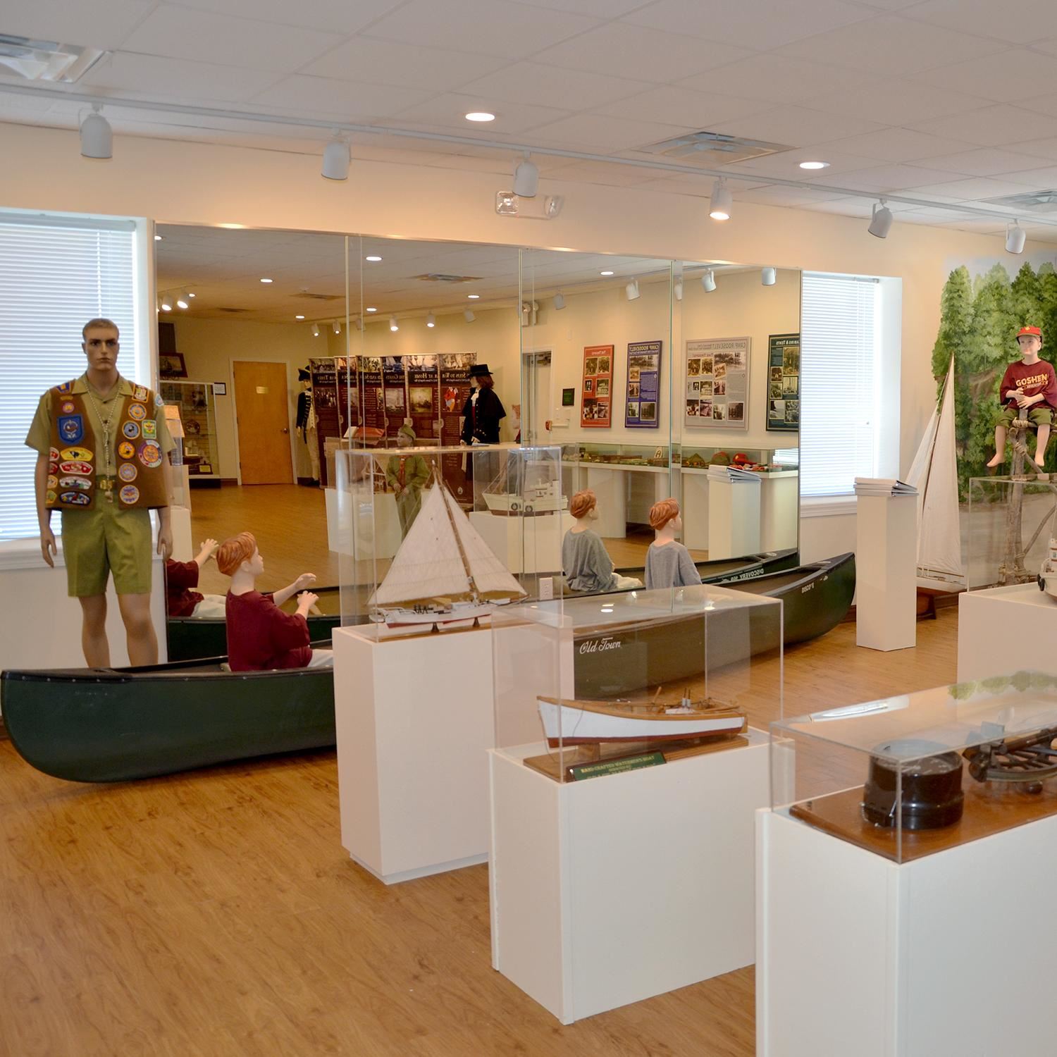 Exhibit room at Bayside History Museum with mannequins exploring nature scenes