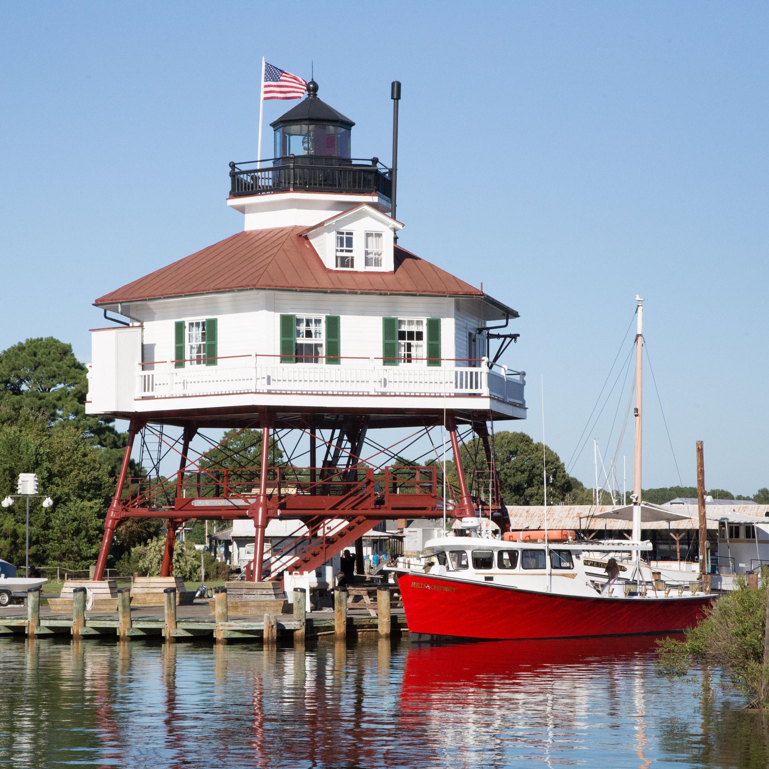Drum Point Lighthouse and a boat on the water