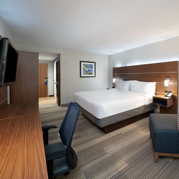 King size bed, desk, and tv at the Holiday Inn