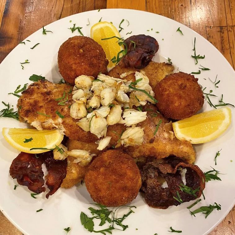 Fish, lump crab meat and lemons